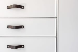 black-handles-of-the-kitchen-drawer-or-cabinet-2021-09-04-01-30-28-utc-scaled-1